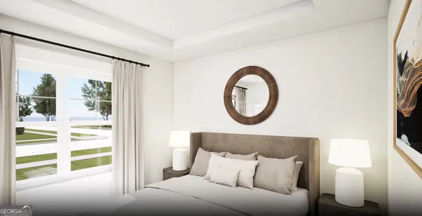 a bedroom with a bed and a large window