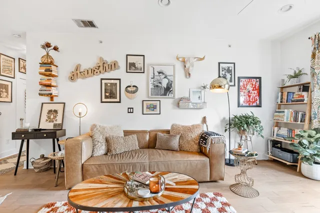a living room with furniture and flower pot