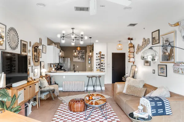 a living room with furniture and a lamp