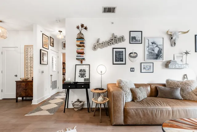 a living room with furniture and a lamp