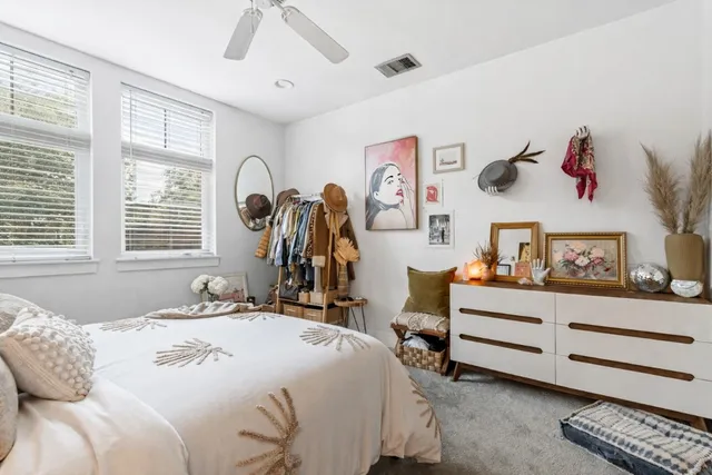 a bedroom with a bed and a dresser