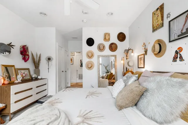 a bedroom with a bed and a cabinets