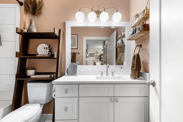 a bathroom with a sink and a mirror