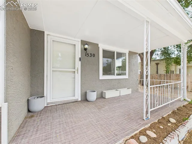 workspace with wooden floor and windows