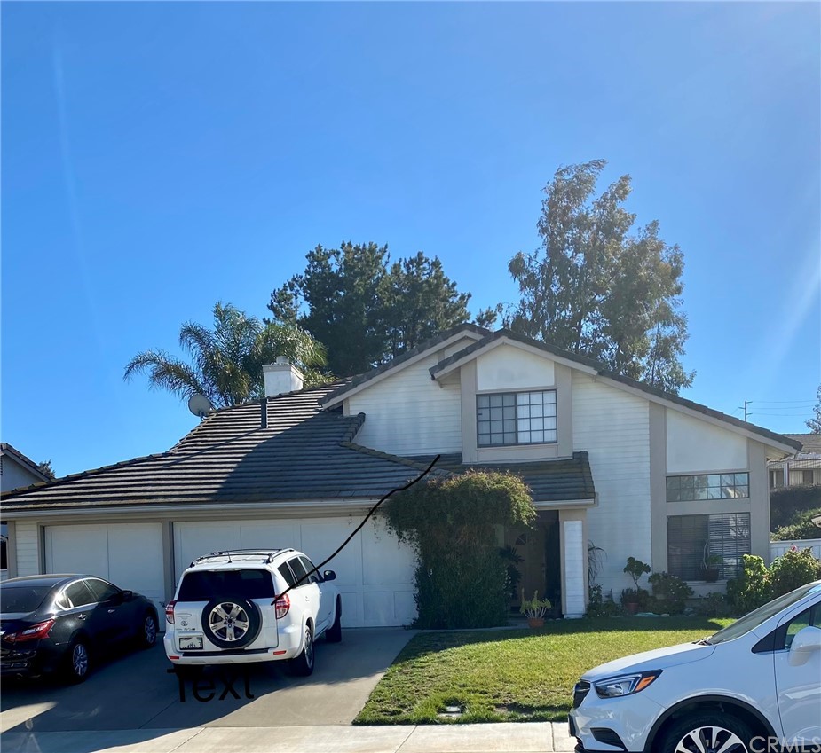 30881 White Rocks Circle Temecula, CA 92591 - Photo 1 of 1 a front view of a house with a garden