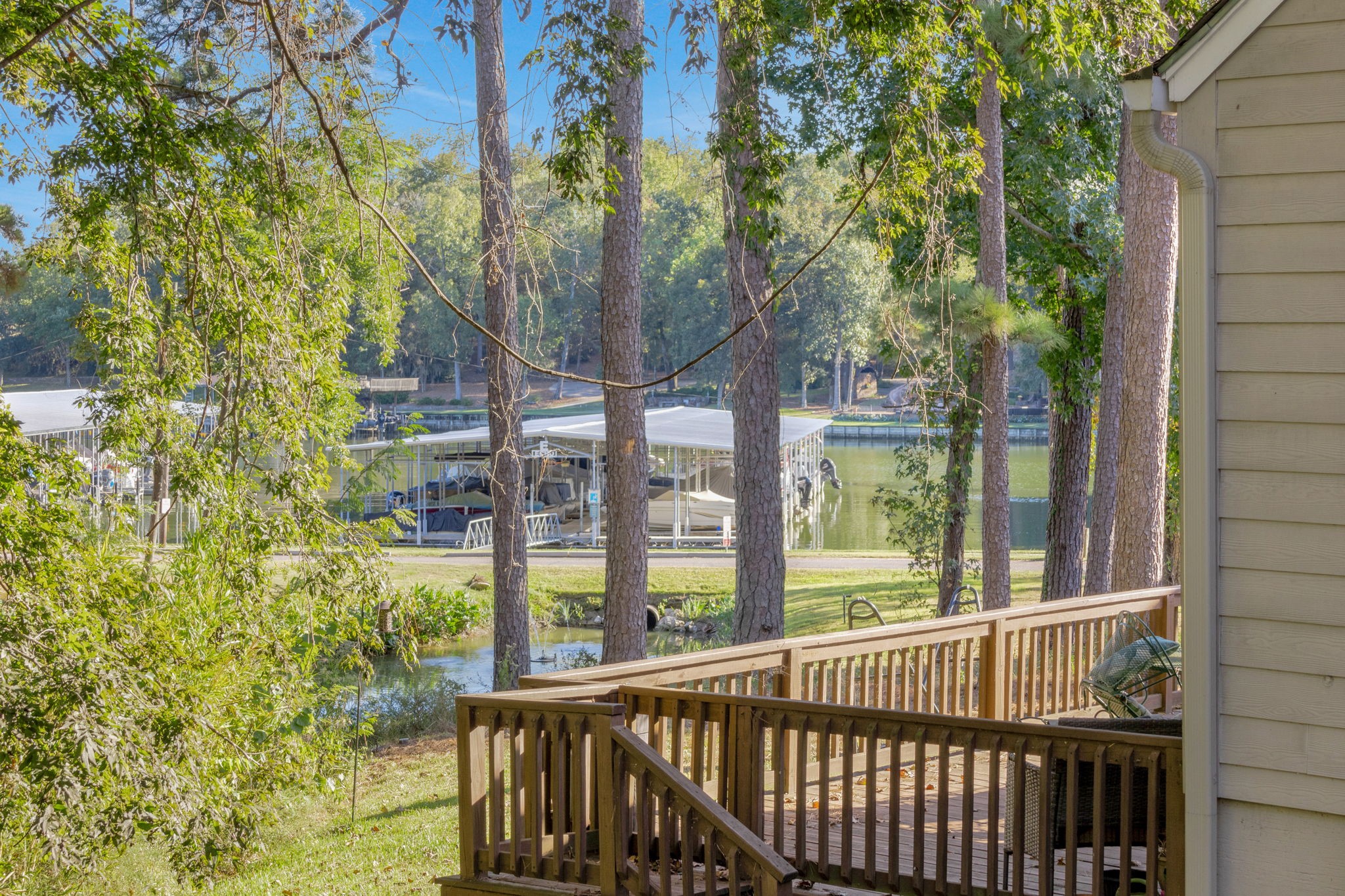 90 Harbour Lane Coldspring, TX 77331 - Photo 20 of 40 The Cape Royale Lilly Pond and Marina are just through the trees.