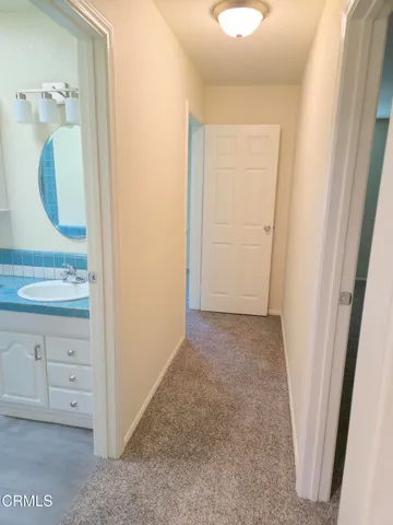 a view of a bathroom from a hallway