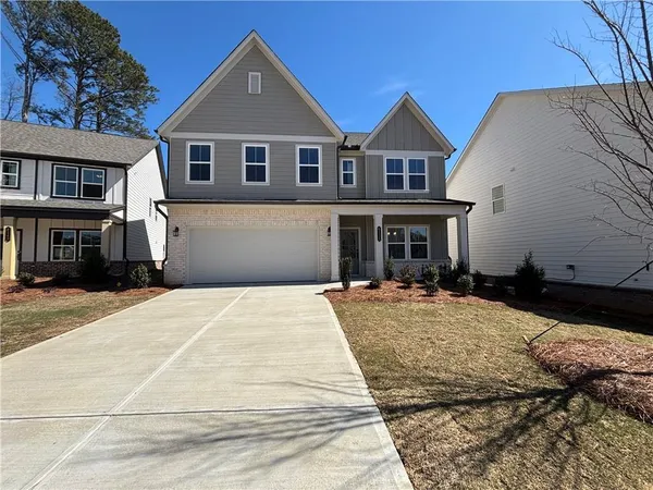 a front view of a house with yard