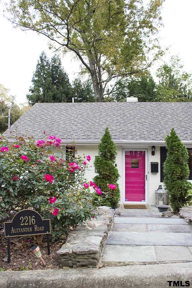 2216 Alexander Road Raleigh, NC 27608 - Photo 1 of 24 a front view of a house with a yard