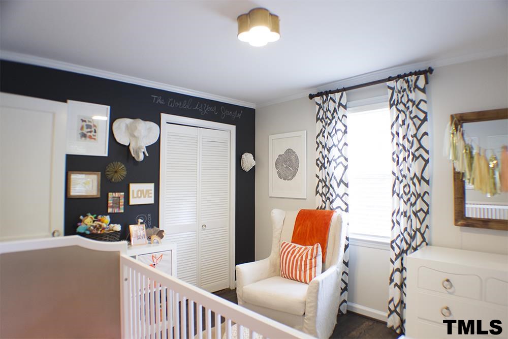 2216 Alexander Road Raleigh, NC 27608 - Photo 11 of 24 a living room with furniture and a large window