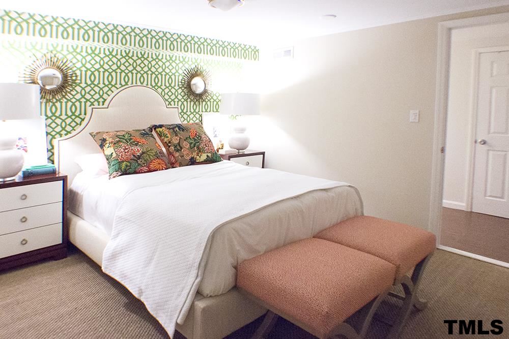 2216 Alexander Road Raleigh, NC 27608 - Photo 20 of 24 a bedroom with a bed and window