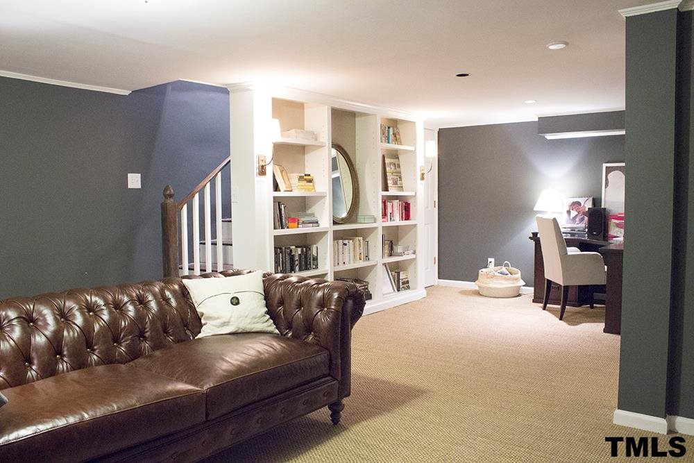2216 Alexander Road Raleigh, NC 27608 - Photo 23 of 24 a living room with furniture window and a lamp