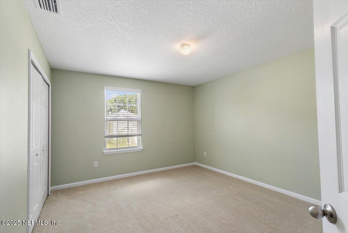 38 Litke Lane St. Augustine, FL 32086 - Photo 11 of 27 an empty room with a window
