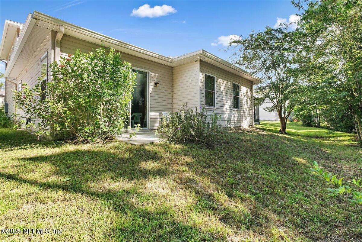 38 Litke Lane St. Augustine, FL 32086 - Photo 13 of 27 a view of a house with yard and a garden
