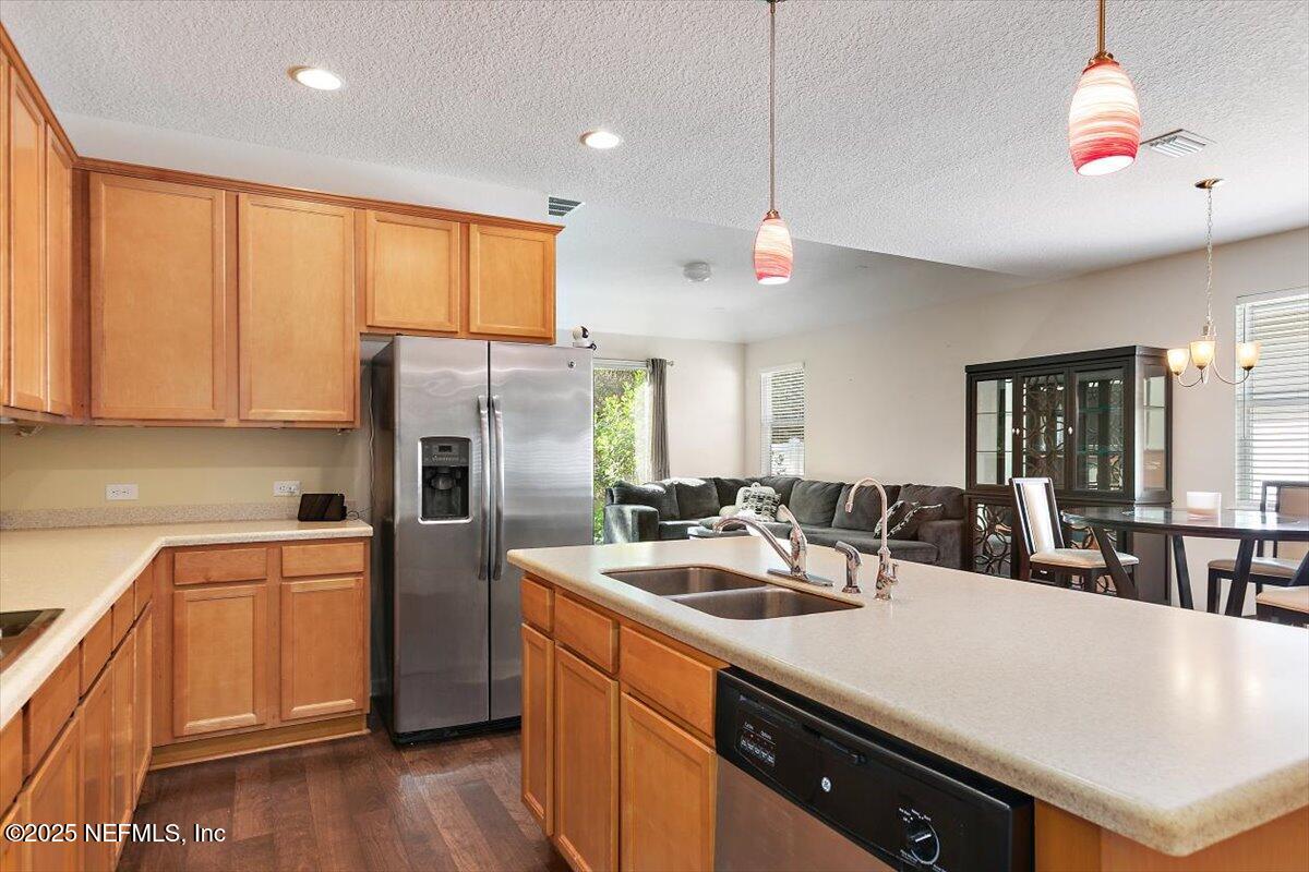 38 Litke Lane St. Augustine, FL 32086 - Photo 22 of 27 a kitchen with refrigerator cabinets and wooden floor
