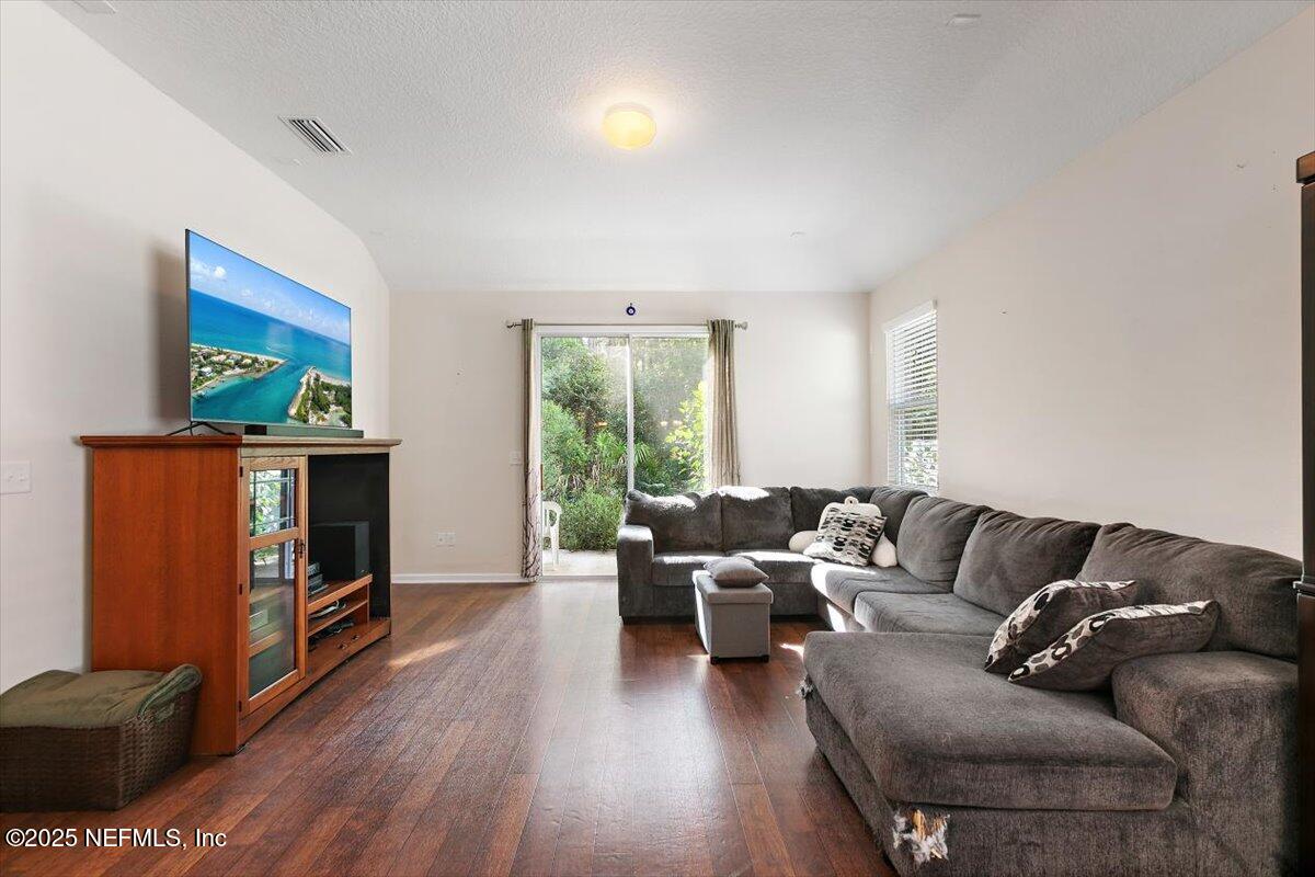 38 Litke Lane St. Augustine, FL 32086 - Photo 23 of 27 a living room with furniture and a fireplace