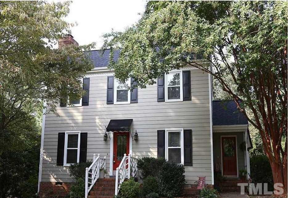 5904 Stable Court Raleigh, NC 27612 - Photo 1 of 16 a front view of a house with a garden
