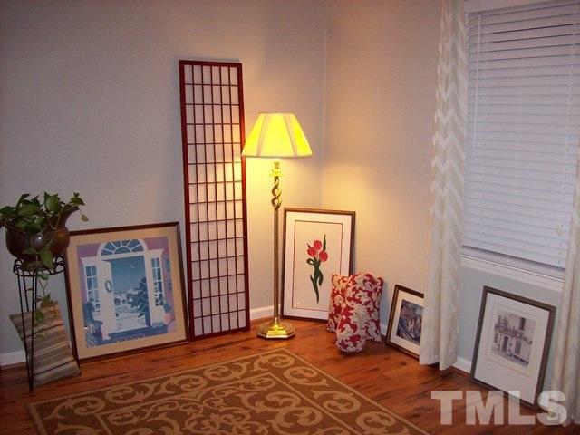 5904 Stable Court Raleigh, NC 27612 - Photo 11 of 16 a living room with furniture and a potted plant