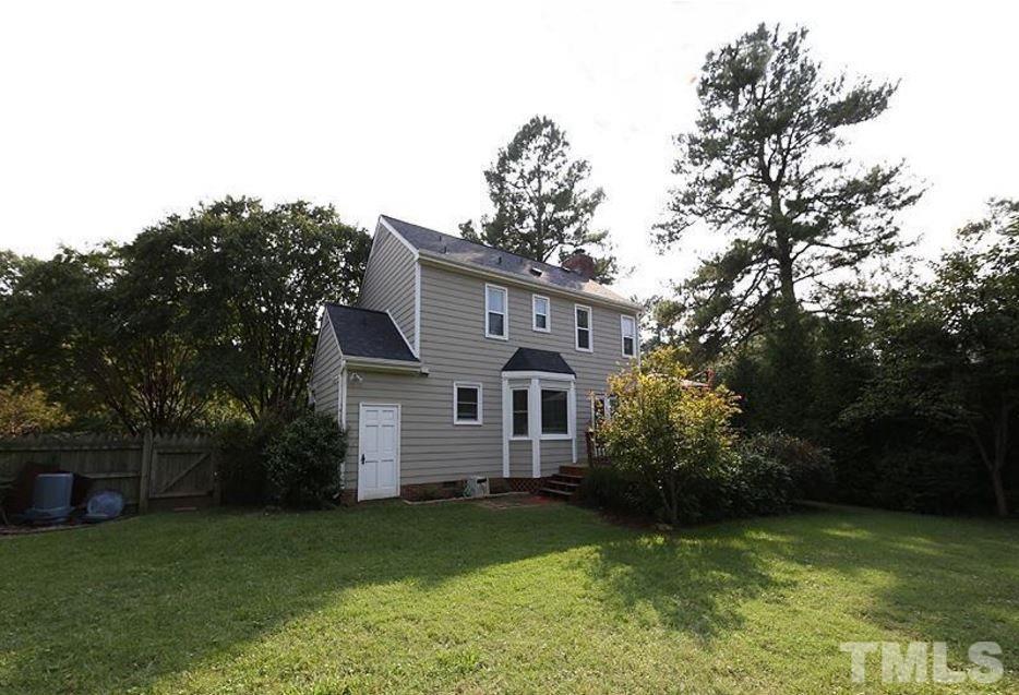 5904 Stable Court Raleigh, NC 27612 - Photo 15 of 16 a view of a house with a yard garage and a tree