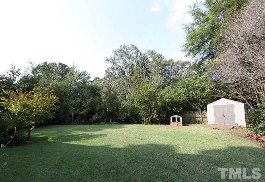 5904 Stable Court Raleigh, NC 27612 - Photo 16 of 16 a front view of a house with a yard