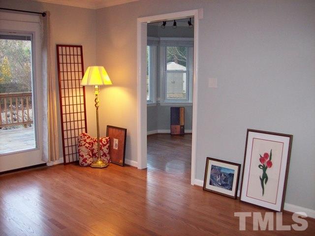 5904 Stable Court Raleigh, NC 27612 - Photo 3 of 16 a view of a room with wooden floor and a window