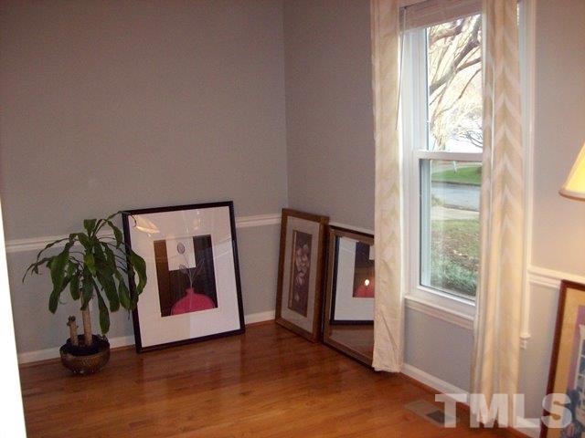 5904 Stable Court Raleigh, NC 27612 - Photo 4 of 16 a living room with furniture and a window