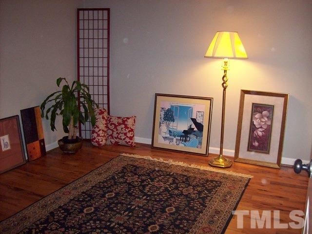 5904 Stable Court Raleigh, NC 27612 - Photo 10 of 16 a living room with furniture and a potted plant