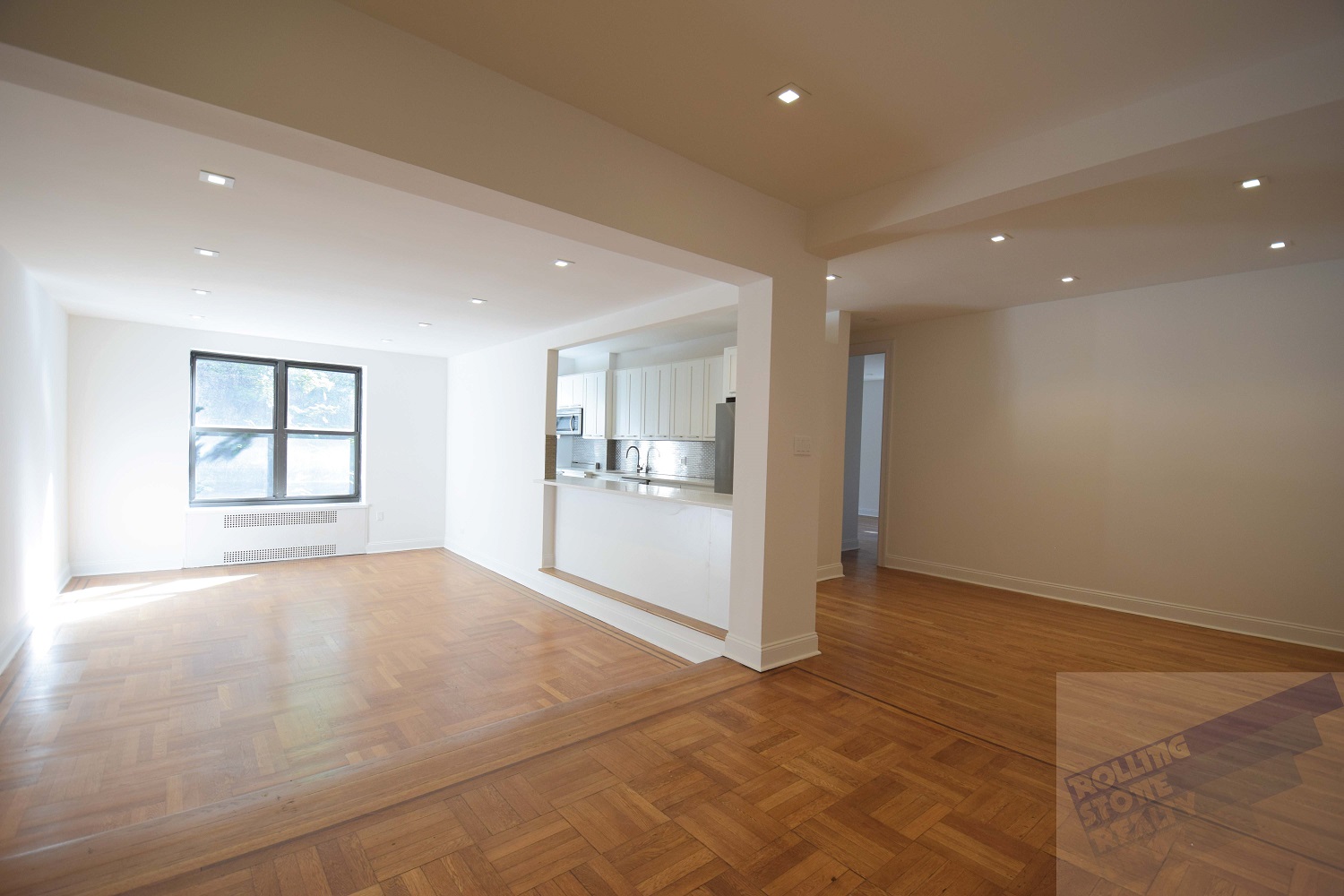 a view of an empty room with a window