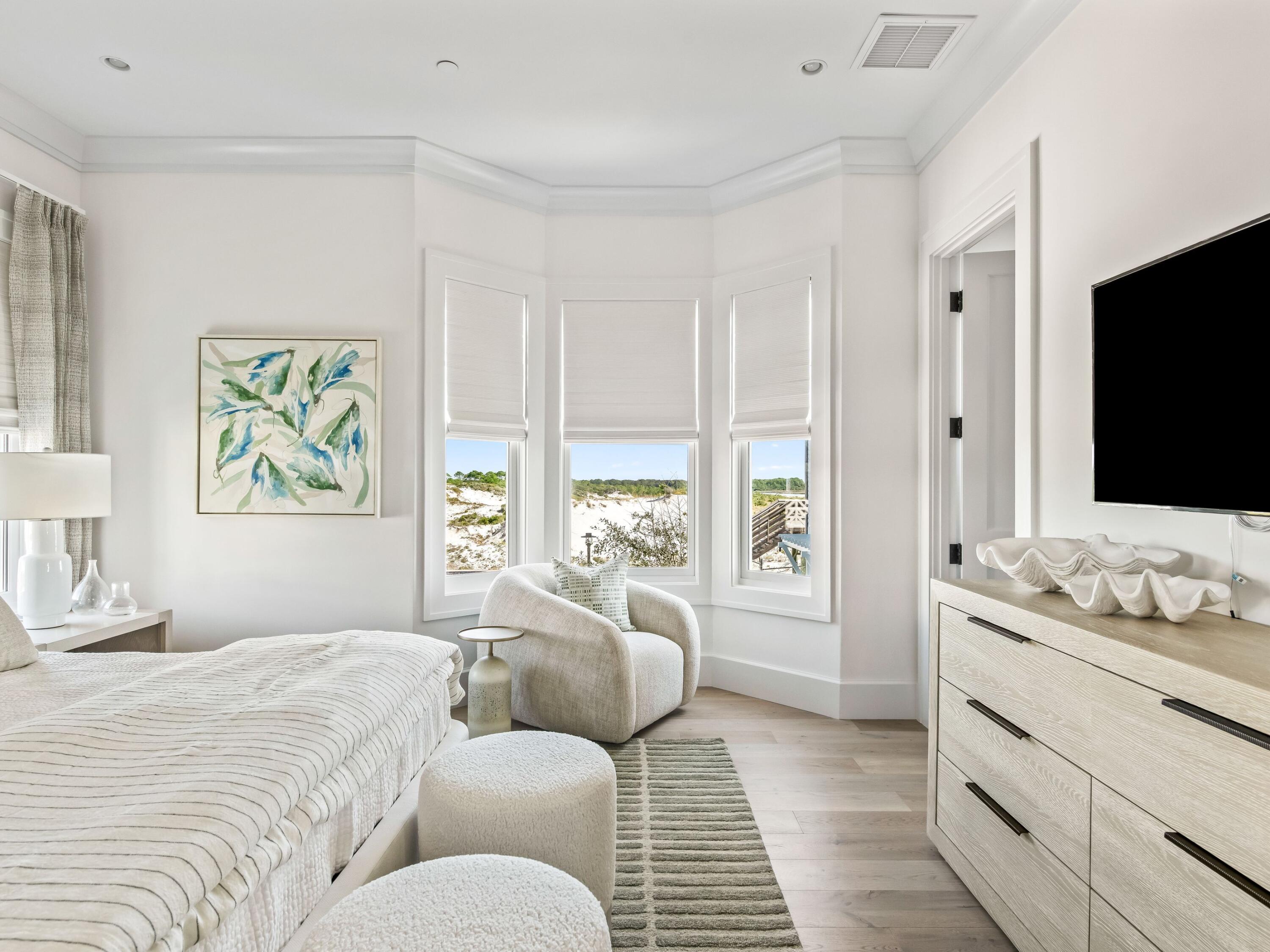 Lot 19 West Lupin Beach Dr Inlet Beach Inlet Beach, FL 32461 - Photo 15 of 57 a bedroom with a bed and a flat screen tv