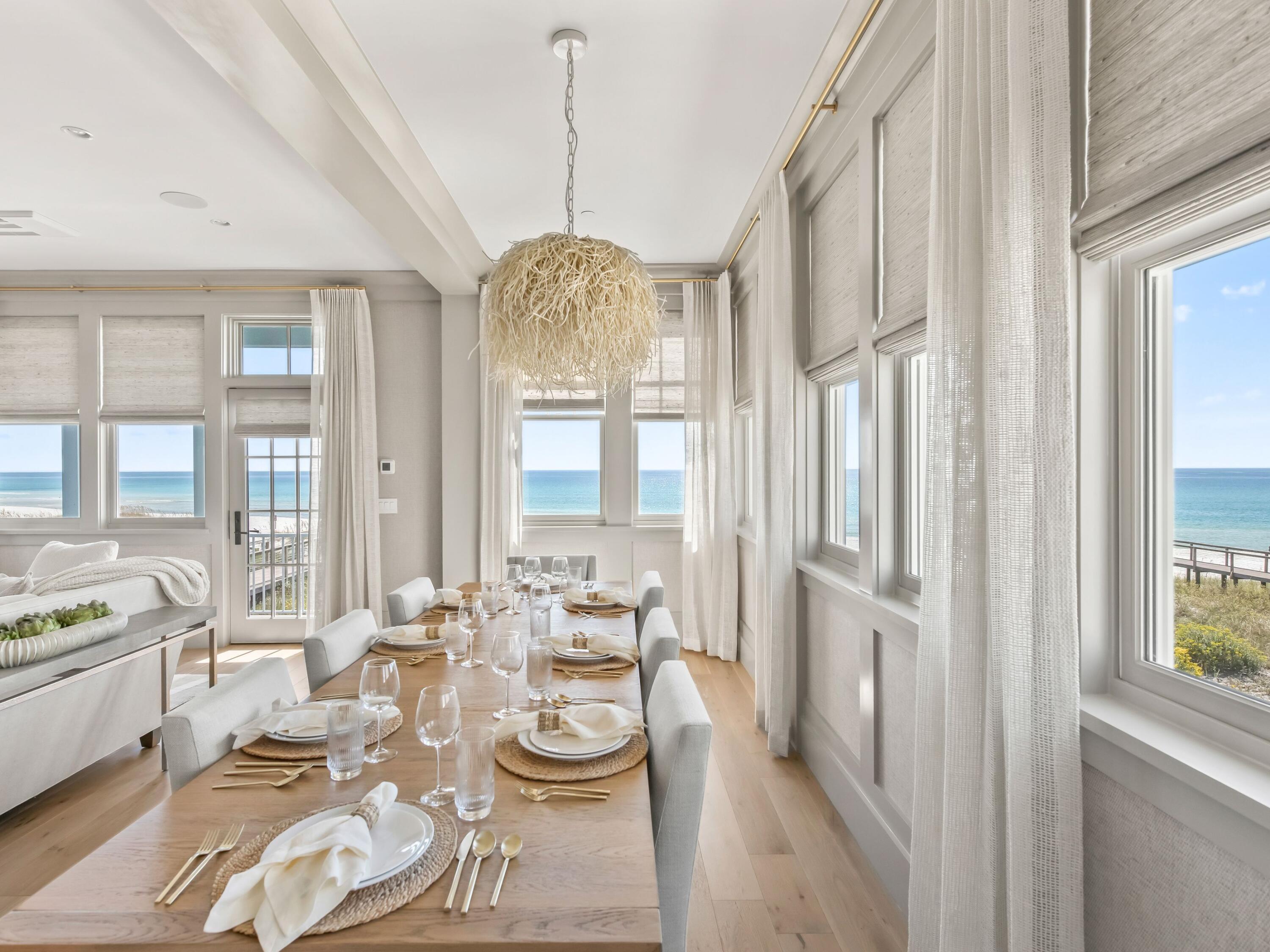 Lot 19 West Lupin Beach Dr Inlet Beach Inlet Beach, FL 32461 - Photo 20 of 57 a view of a dining room with furniture a chandelier and large windows