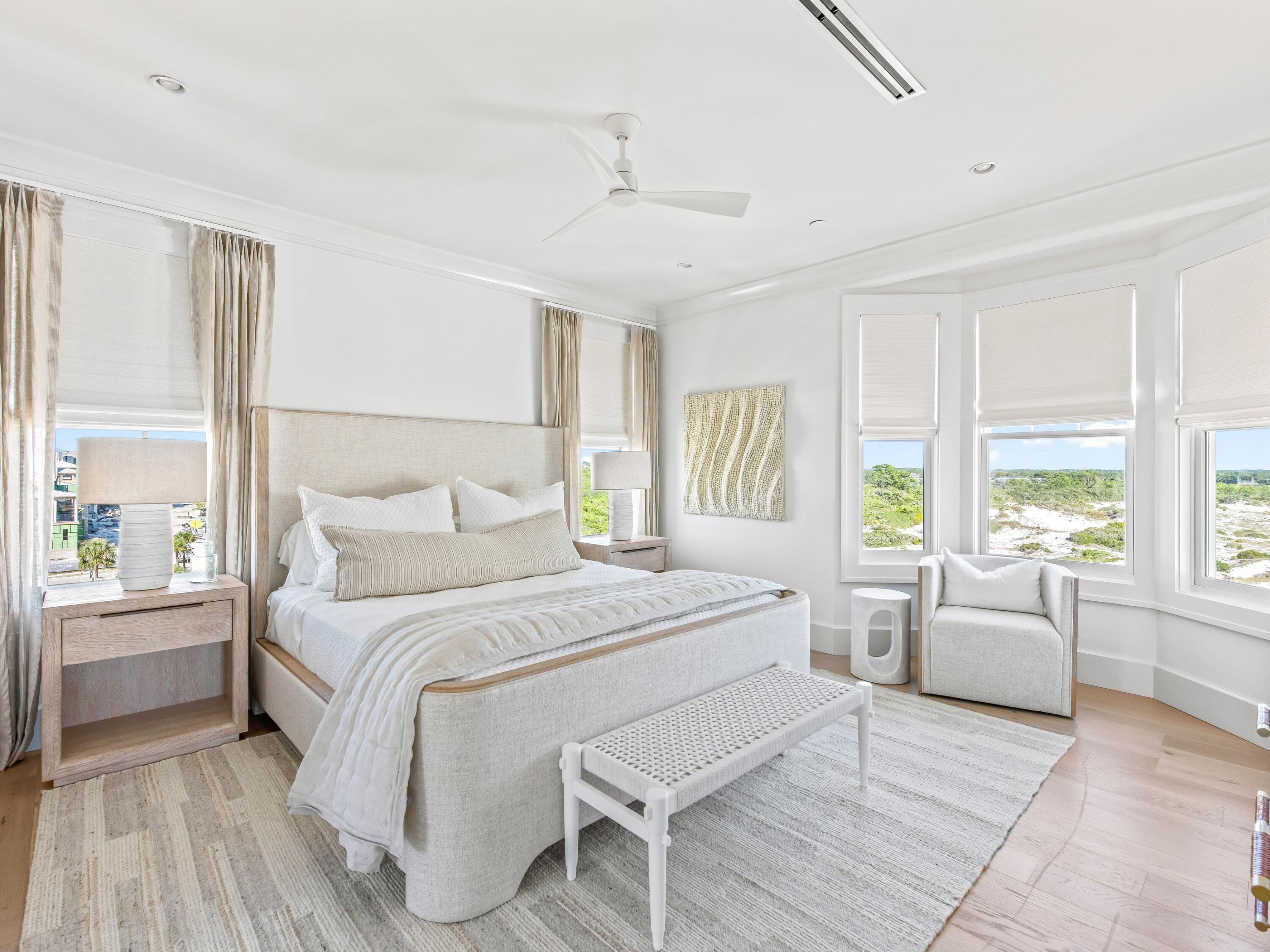 Lot 19 West Lupin Beach Dr Inlet Beach Inlet Beach, FL 32461 - Photo 44 of 57 a bedroom with a large bed couch and a large window