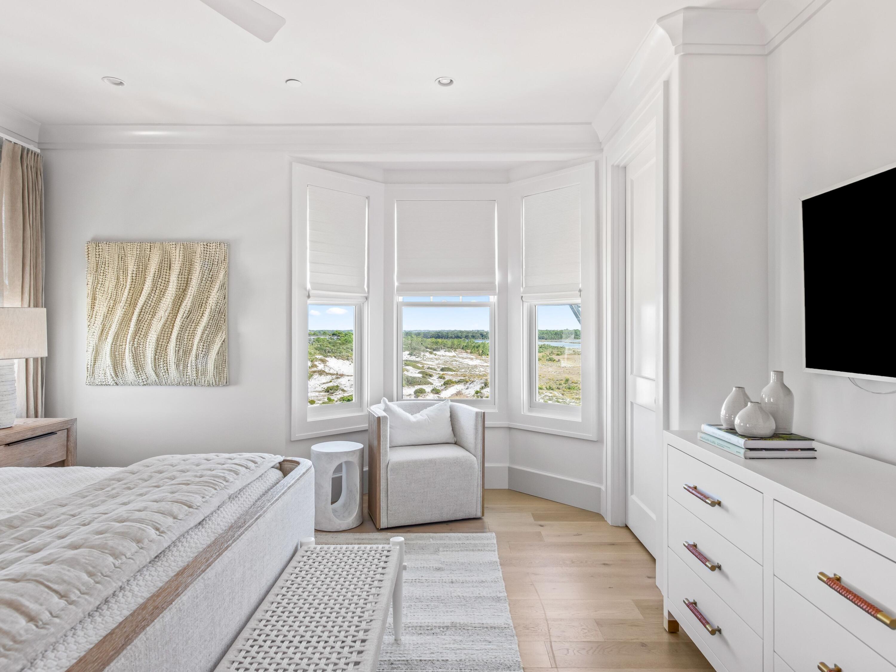 Lot 19 West Lupin Beach Dr Inlet Beach Inlet Beach, FL 32461 - Photo 45 of 57 a bedroom with a large bed and a flat screen tv