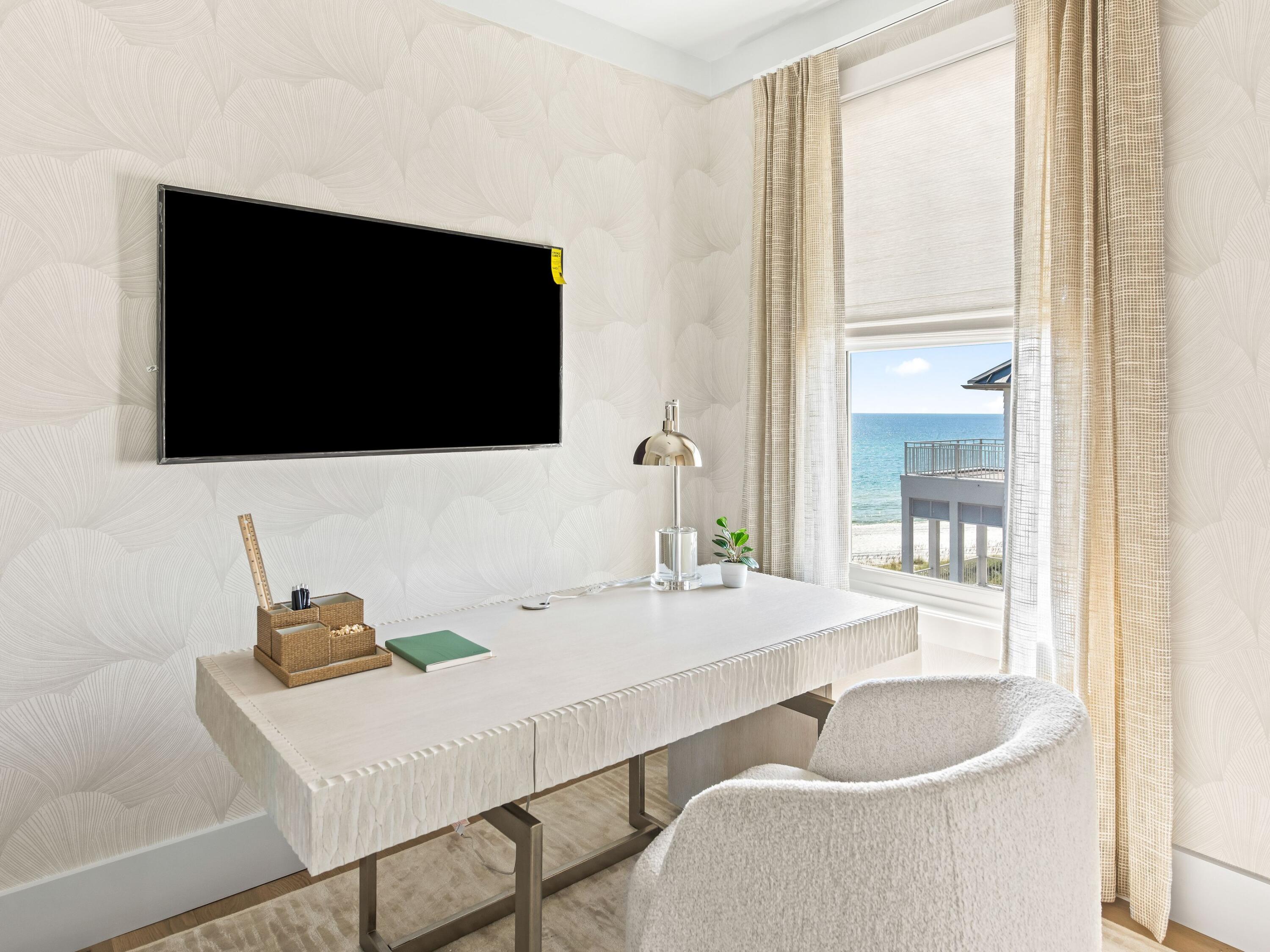 Lot 19 West Lupin Beach Dr Inlet Beach Inlet Beach, FL 32461 - Photo 47 of 57 a room with a table chairs and a flat screen tv