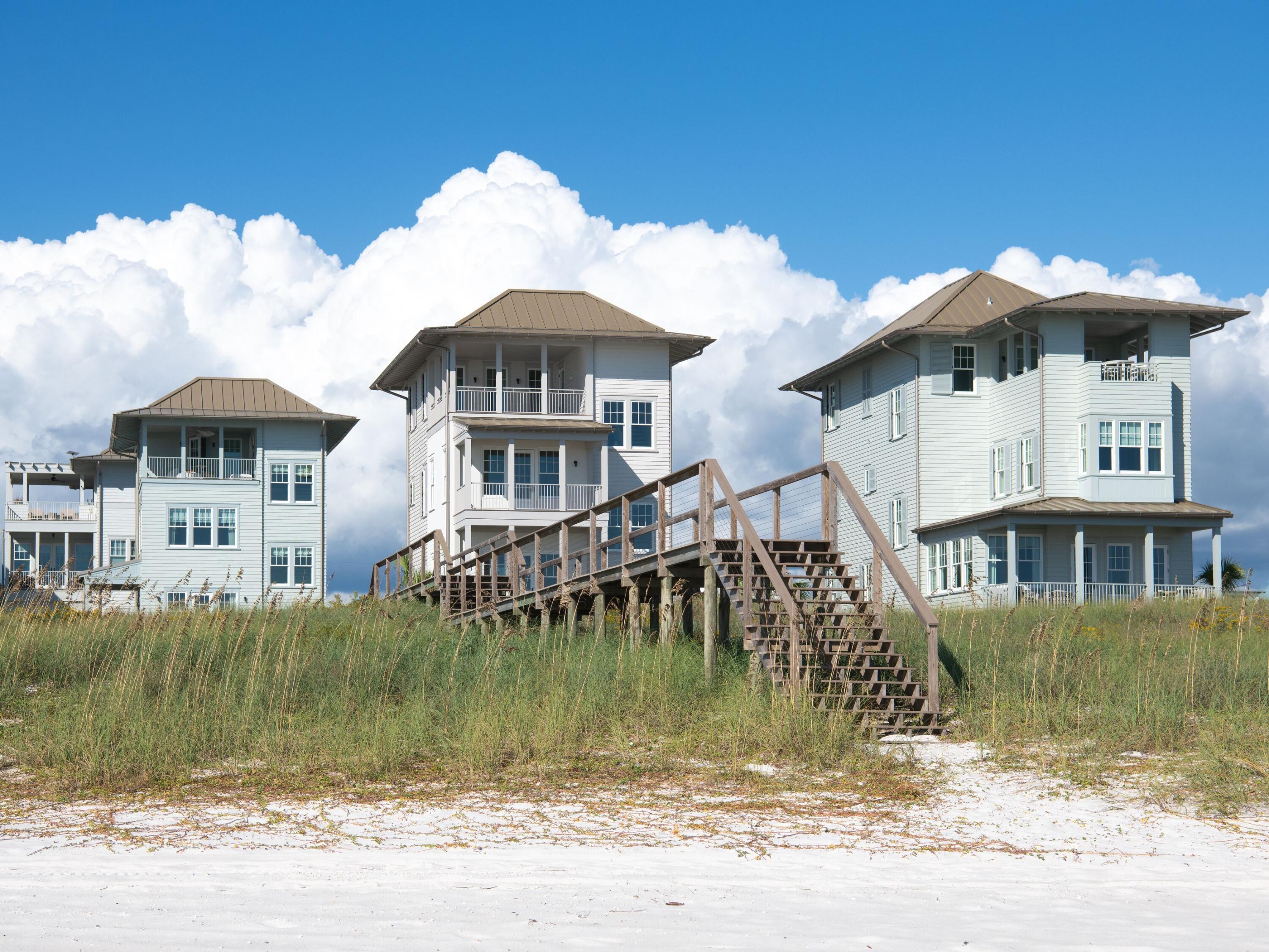 Lot 19 West Lupin Beach Dr Inlet Beach Inlet Beach, FL 32461 - Photo 56 of 57 a front view of a house with a garden