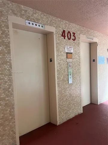 a room with a sink cabinets and wooden floor