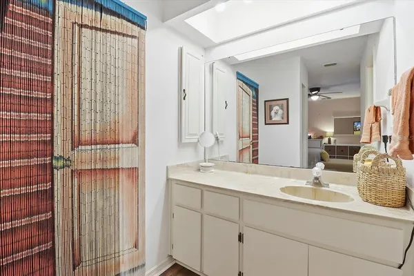 a bathroom with a double vanity sink and a mirror