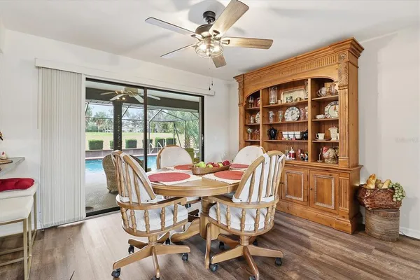 a view of a dining room with furniture window and wooden floor