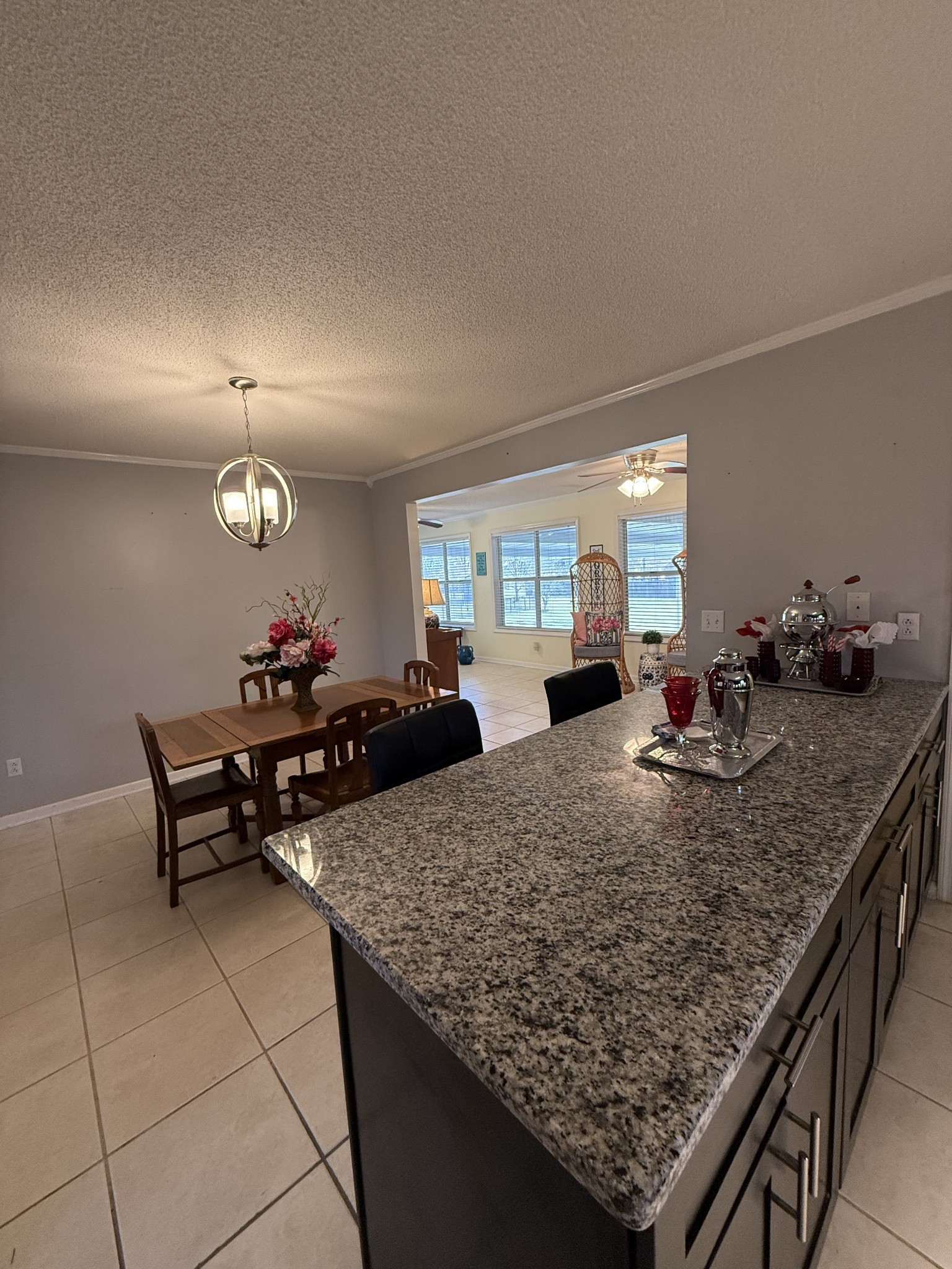 405 Robins Street Lawrenceburg, TN 38464 - Photo 12 of 65 a kitchen island with granite countertop breakfast area