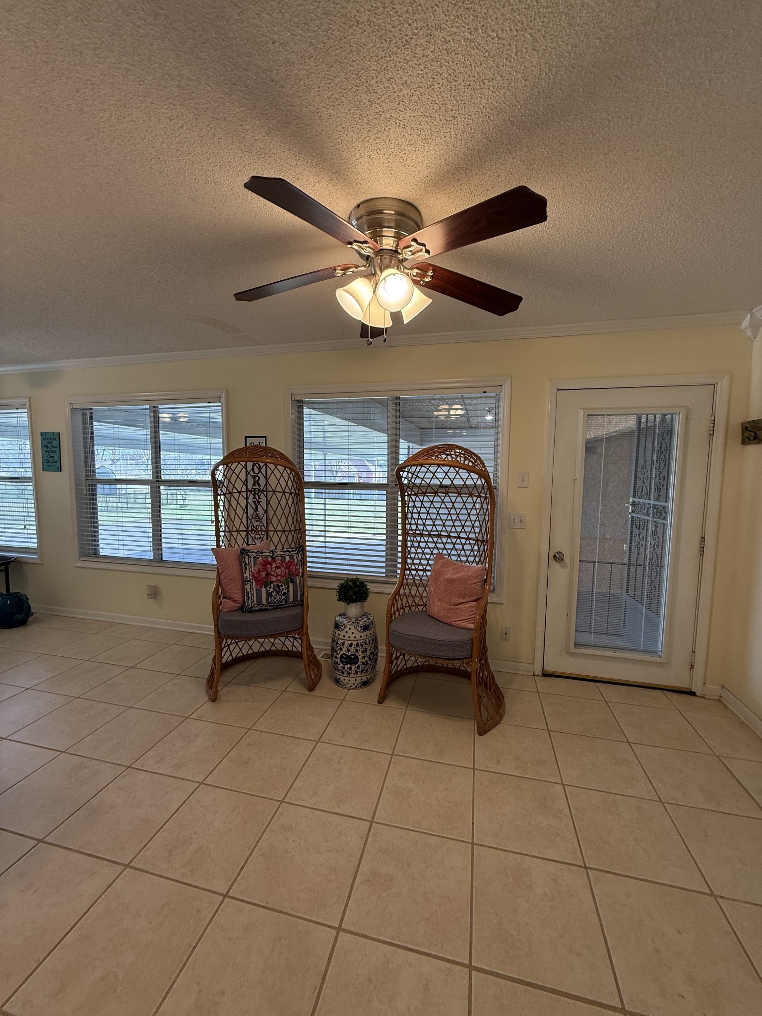405 Robins Street Lawrenceburg, TN 38464 - Photo 16 of 65 a living room with furniture a ceiling fan a rug and a window
