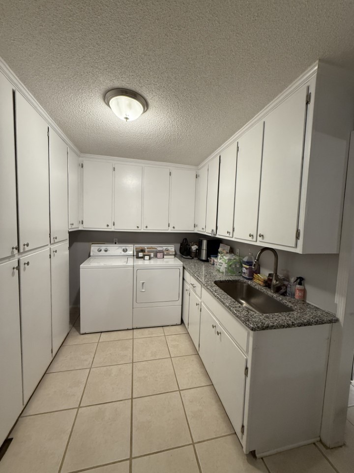 405 Robins Street Lawrenceburg, TN 38464 - Photo 19 of 65 a kitchen with stainless steel appliances granite countertop a sink and cabinets
