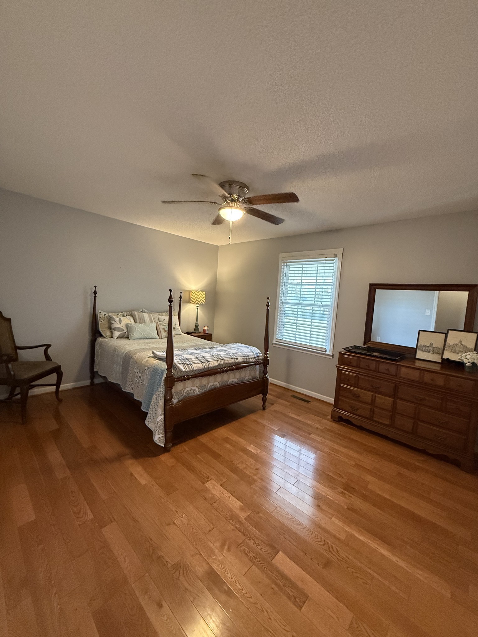 405 Robins Street Lawrenceburg, TN 38464 - Photo 20 of 65 a bedroom with a bed and wooden floor