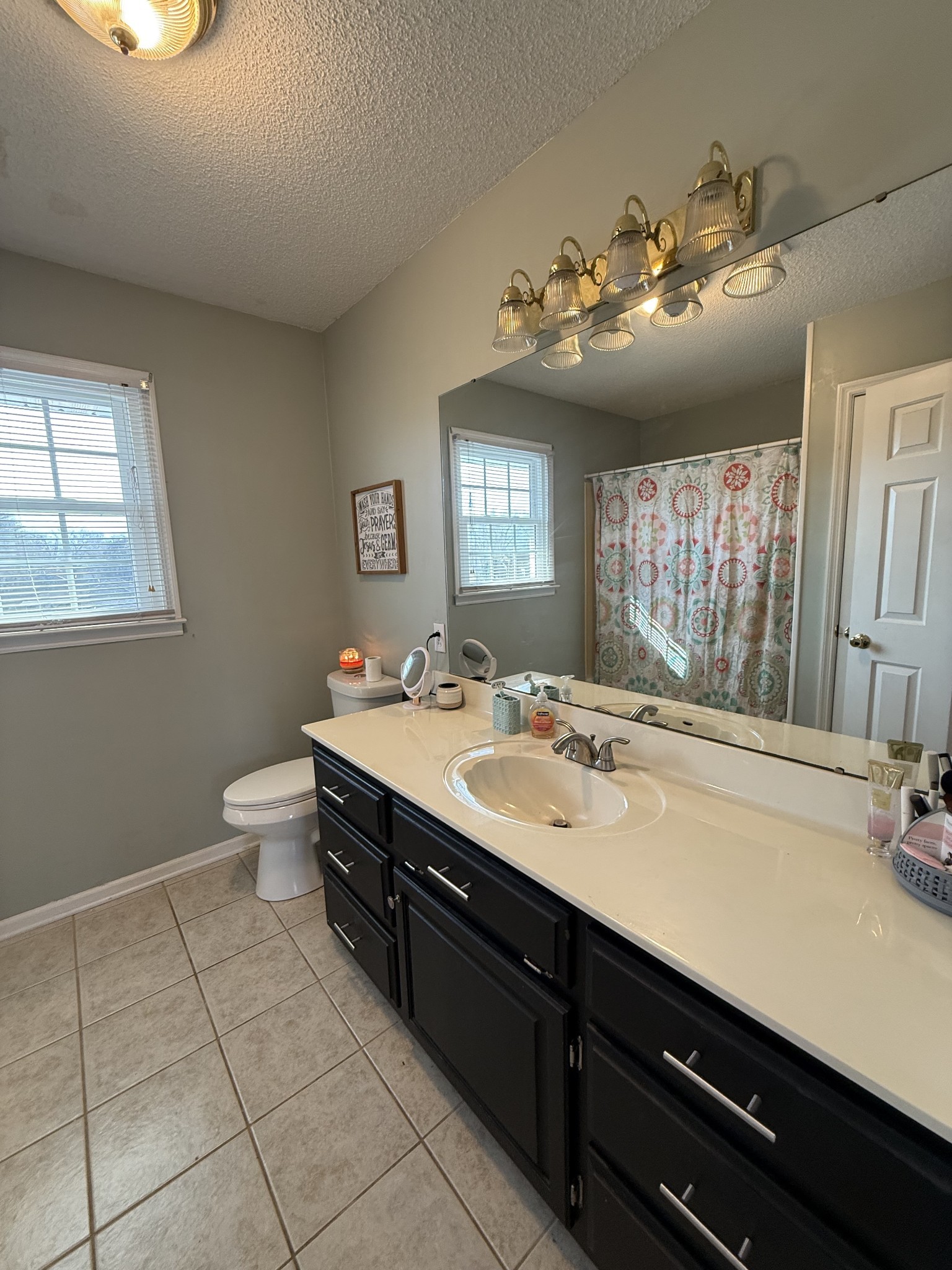 405 Robins Street Lawrenceburg, TN 38464 - Photo 35 of 65 a bathroom with a sink vanity and toilet