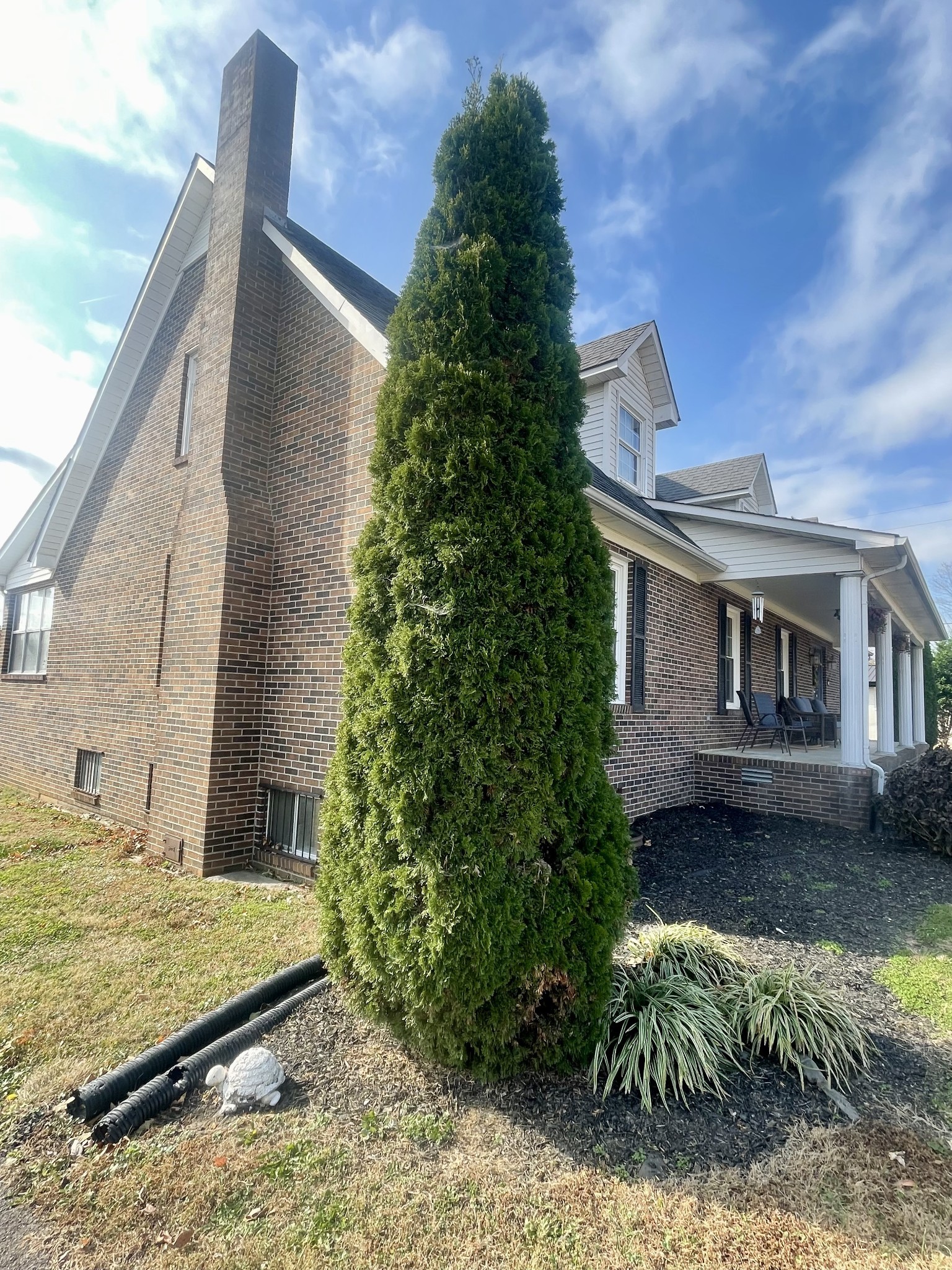 405 Robins Street Lawrenceburg, TN 38464 - Photo 41 of 65 a front view of a house with garden