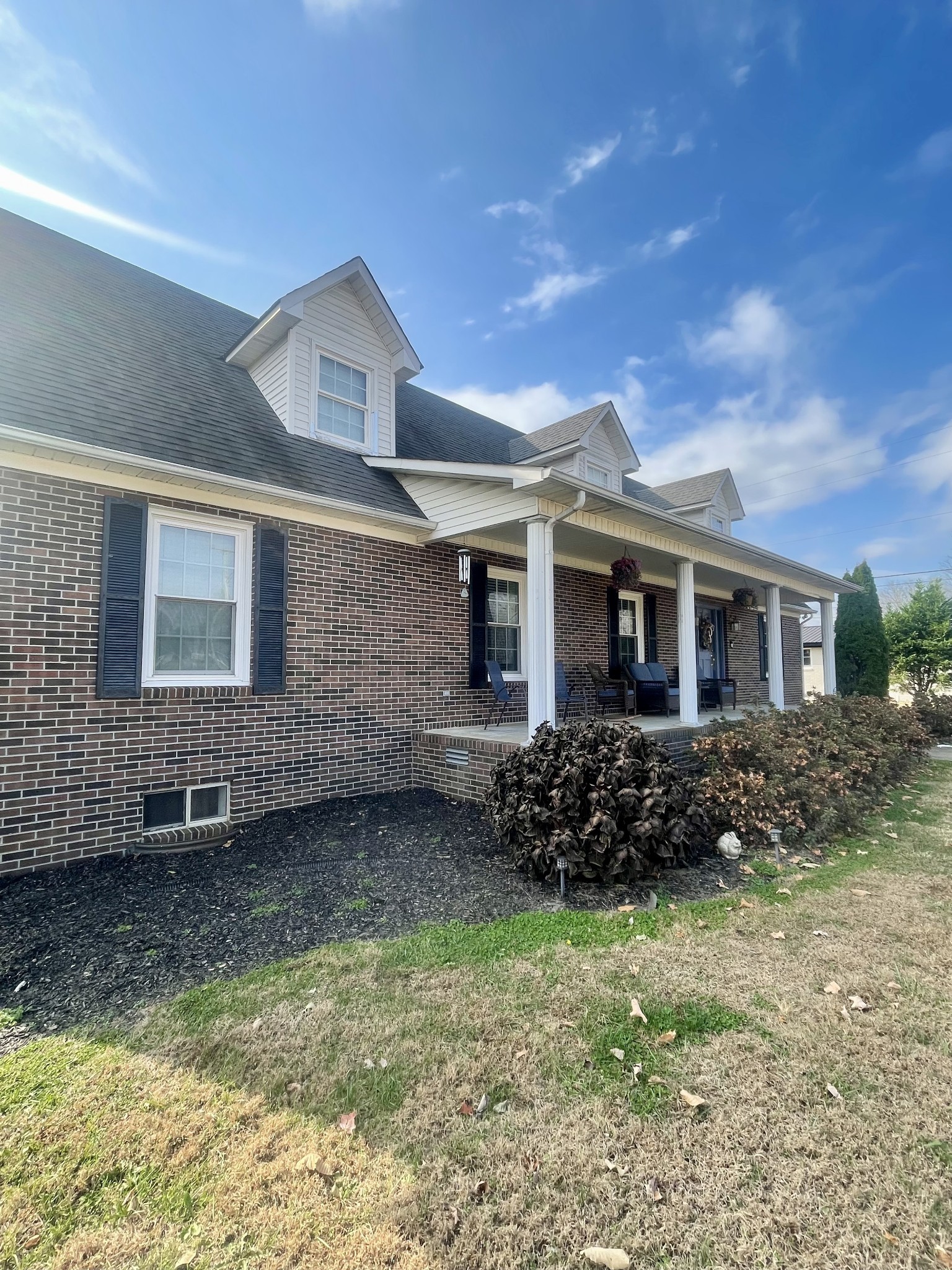 405 Robins Street Lawrenceburg, TN 38464 - Photo 43 of 65 a front view of a house with garden