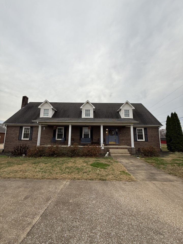 405 Robins Street Lawrenceburg, TN 38464 - Photo 49 of 65 front view of a house with a yard