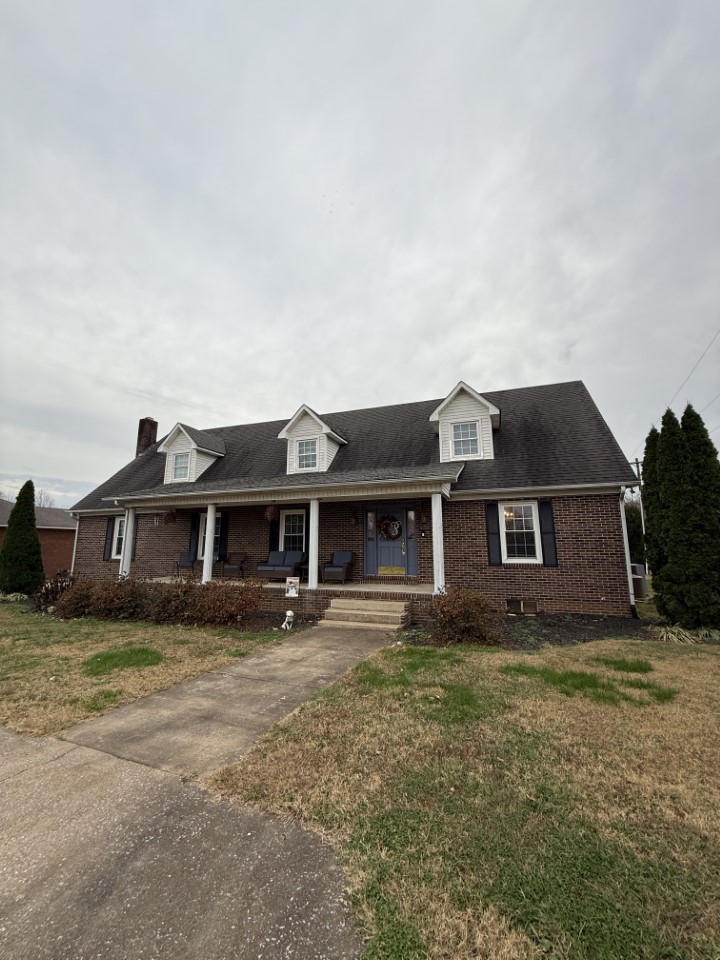 405 Robins Street Lawrenceburg, TN 38464 - Photo 50 of 65 a front view of a house with yard