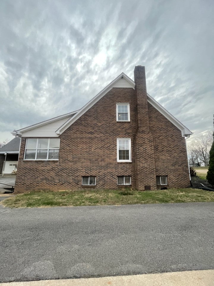 405 Robins Street Lawrenceburg, TN 38464 - Photo 54 of 65 a front view of a house with a yard