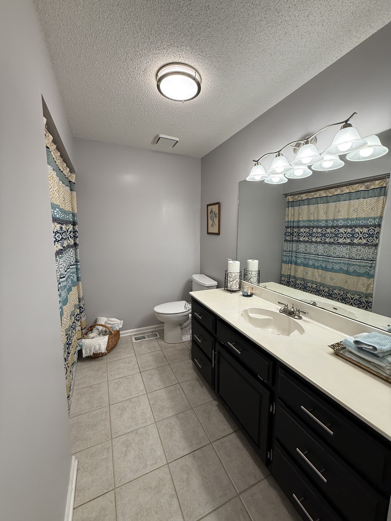 405 Robins Street Lawrenceburg, TN 38464 - Photo 60 of 65 a bathroom with a sink vanity and a mirror