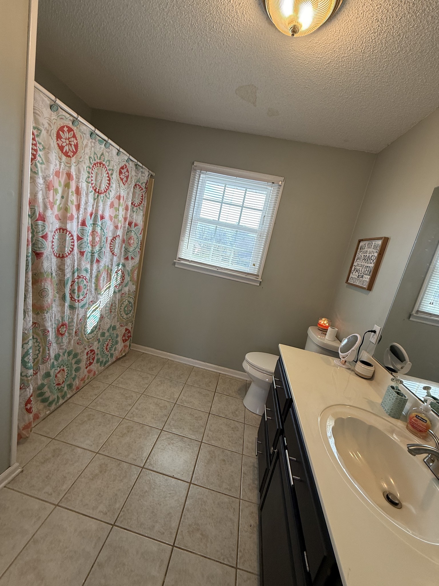 405 Robins Street Lawrenceburg, TN 38464 - Photo 62 of 65 a bathroom with a sink and a mirror
