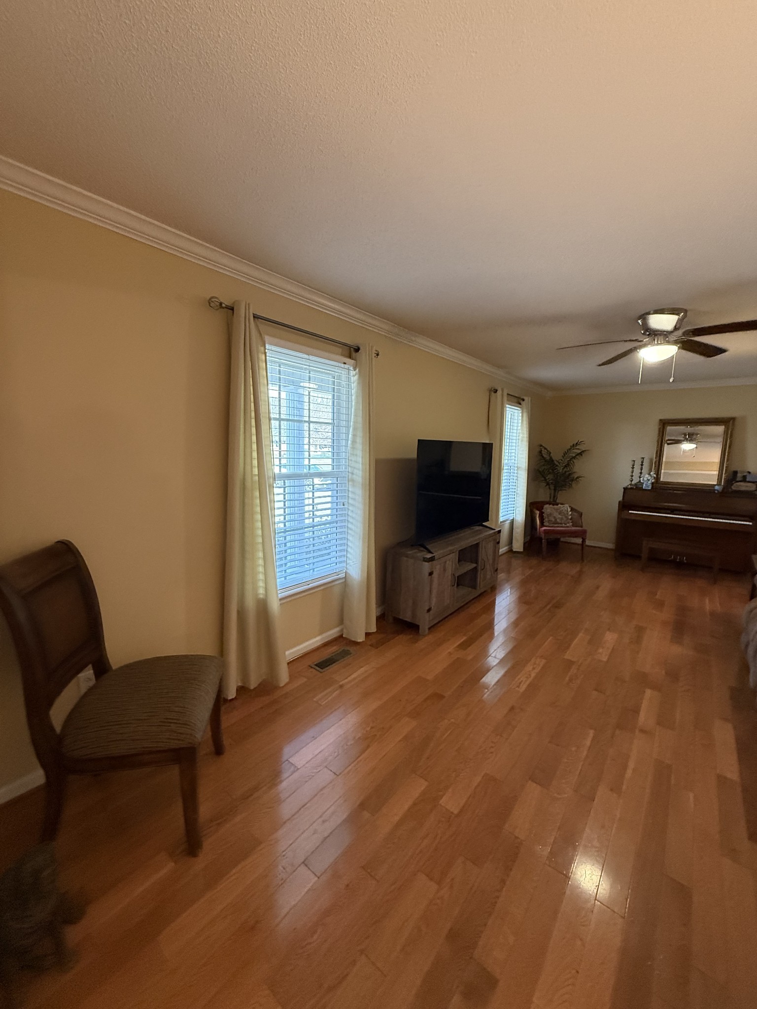 405 Robins Street Lawrenceburg, TN 38464 - Photo 8 of 65 a living room with furniture and a flat screen tv